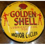A convex enamel advertising sign for Golden Shell, dia.30cm