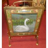 An Art Nouveau brass framed and hardstone inset fire screen decorated with a swan, width 51cmVery