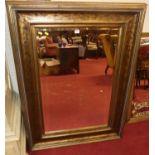 A large contemporary gilt framed bevelled rectangular wall mirror, 123 x 92cm