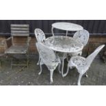 A Victorian style white painted galvanised and pierced metal patio suite comprising; circular table,