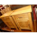 A pair of contemporary light oak bedside cupboards, width 48.5cm