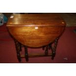 A 1920s oak barley twist gateleg occasional table