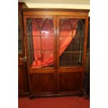 A 19th century mahogany double door side cabinet, having lancet glazed upper doors, w.