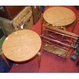 Two nests of three similar mid-century melamine turned beech and brass mounted circular occasional