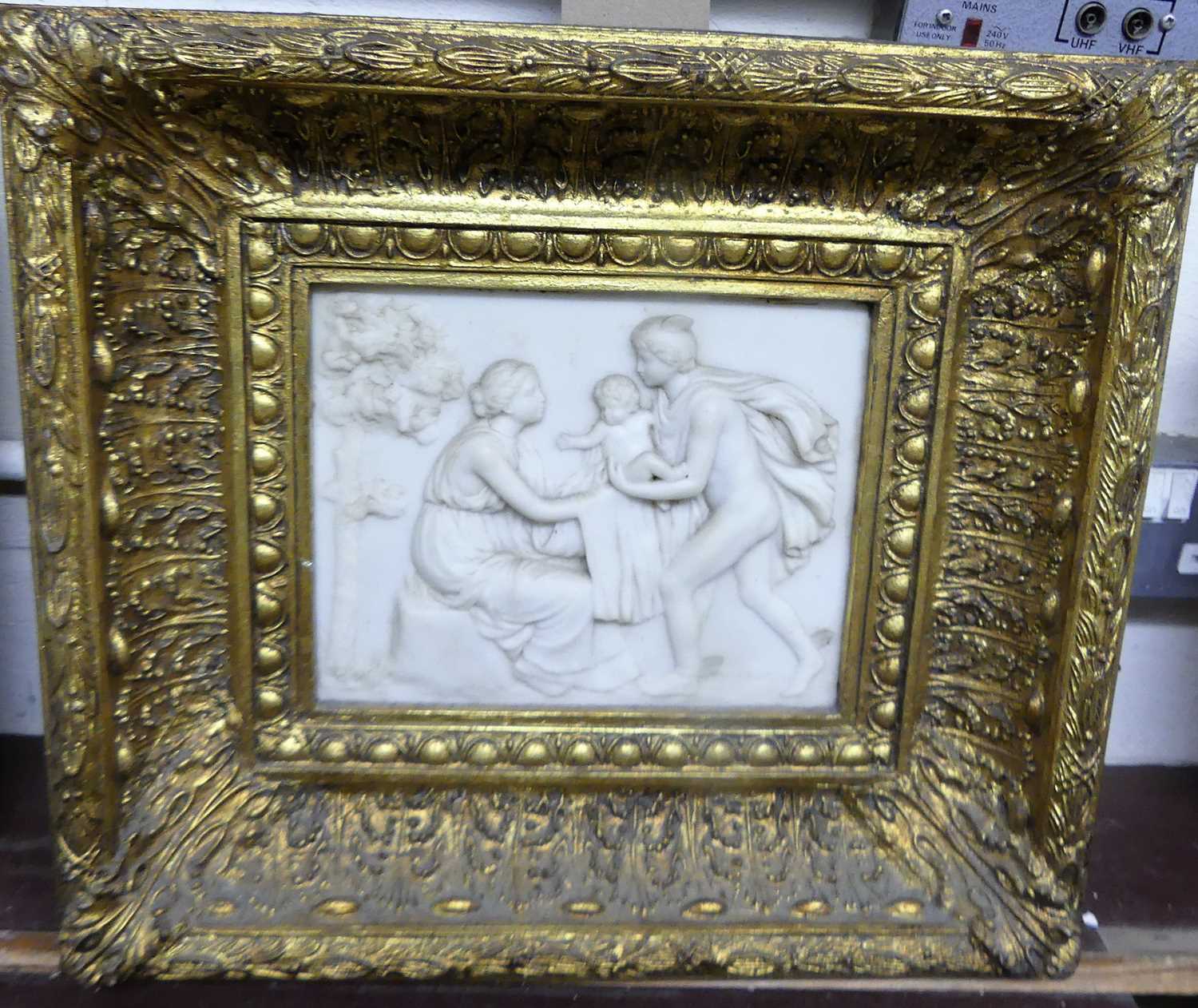 A reproduction composition wall plaque in heavy gilt frame, gross dimensions 40 x 44cm