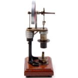 Julian Wood Style vertical Hot Air Stirling Engine, comprising burner situated beneath vertical heat