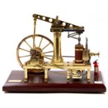 An all brass scale model of a live steam beam engine, fitted with a 12V DC Drive motor to underside,