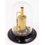 A miniature kit built model of a spirit fired single cylinder vertical steam engine, height 9cm, and