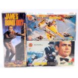 A collection of James Bond related plastic kits to include a Polar Lights James Bond 007 action