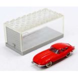 A Lego System E Type Jaguar finished in red together with its own individual garage - a rare item