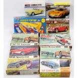 Boxed containing various plastic model car kits by Revell, Blue Box, Airfix and others, some