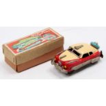 Japanese miniature tinplate and friction drive model of a Baby Star Car comprising cream and red
