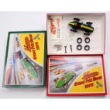 Schuco No.1075 Grand Prix Racer Set, comprising green tinplate car with tools and replacement