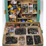 Two trays containing a quantity of various diecast modelling spares to include various chassis,