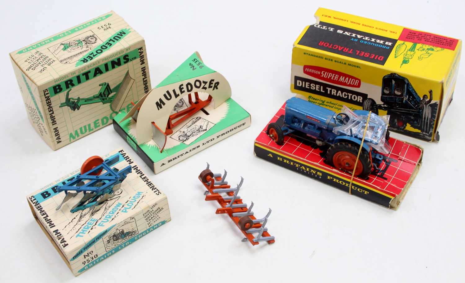 A small collection of part boxed Britains Farming models comprising a Fordson Super Major Tractor, a