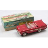 Nomura (T.N. Toys) of Japan tinplate Battery Operated Ford Fairlane Skyliner comprising a red