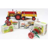 A collection of Kovap Czech Republic boxed tinplate tractor and attachment group to include