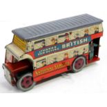 A Wells of London tinplate and clockwork London double deck bus comprising a printed tin body,