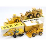 A collection of four various boxed Caterpillar Conrad, NZG and Supermini 1/50 scale construction