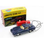 A Marx Toys plastic and battery operated model of a Corvette Stingray finished in dark blue with