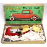 A Chad Valley Ubilda motor car comprising of various tinplate components to construct a motorcar,