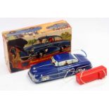 A Welsotoys No. 141 tinplate and remote control battery operated model of a police car with