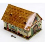 A vintage Parein Biscuits Belgian novelty Biscuit Tin money box in the form of a chalet with printed