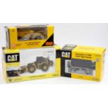 A Norscot and ERTL boxed Caterpillar construction vehicle group to include an ERTL No. 2438