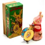 An Alps Toys of Japan tinplate and soft covered model of Peter the Peppy Drummer, comprising of pink