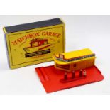 A Matchbox Lesney MG1 Garage, Showroom & Service Station for Matchbox Toys comprising a yellow and
