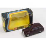 Corgi Toys Whizzwheels No. 418 London Taxi comprising a dark maroon body, with a red interior and