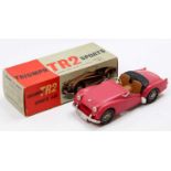 Victory Industries 1/18th scale plastic model of a Triumph TR2 Sports Car, red body, with black