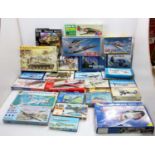 Two boxes of boxed plastic military aircraft kits to include Tamiya, Extra Tech, Italeri and others,