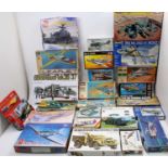 Two boxes of various mixed plastic military and aircraft kits to include Revell, Tamiya, Airfix