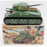 A Taiyo Toys of Japan tinplate and battery operated model of an M-4 Combat Tank, fitted with