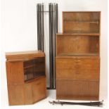 A 1970s Avalon teak modular wall unit, comprising; two corner sections, one with twin glass