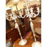 A pair of contemporary silvered metal five-branch standing candelabrum, h.100cm