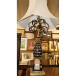 A contemporary black painted and gilt decorated pineapple lamp, with hexagonal silk shade, height (