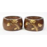 A pair of Japanese Taisho Period (1912-26) elm hibachi, each of cylindrical form, being metal lined,