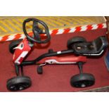 A child's racing pedal go-kart