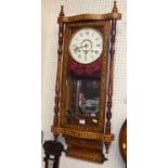 A Victorian rosewood, walnut and further inlaid droptrunk wall clock, having twin winding holes,