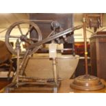 A provincial fruitwood and elm spinning wheel, together with a squirrel cage skein winder (2)