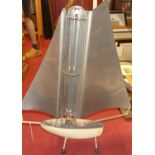 A 1950s Bunting 'Yacht' fire, electric heater, in the form of a sailing boat, label verso, h.77cm,