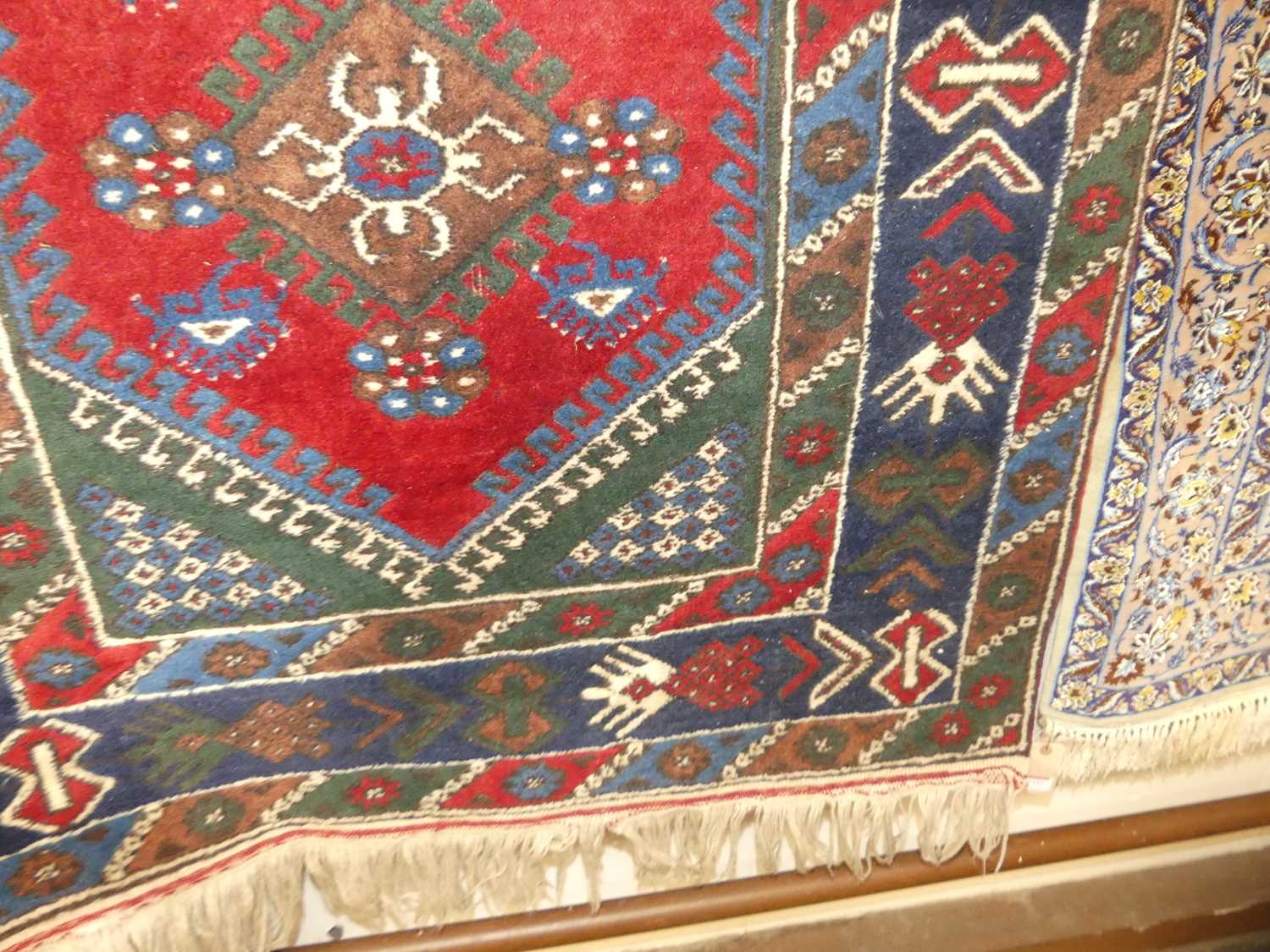 A Turkish woollen red and blue ground rug, the lozenge central field within conforming trailing - Image 3 of 3