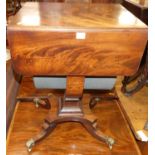 A William IV mahogany round cornered dropflap pedestal two drawer work table, having lower basket
