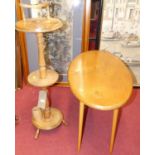 A turned fruitwood sewing stand, together with an Ercol style elm and beech oval occasional table (