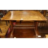 An early 20th century oak low occasional table, having cleated ends, length 76.5cm