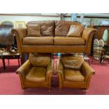 A contemporary tan leather three-piece suite, comprising; two-seater sofa, pair of armchairs, and