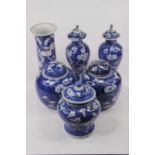 A pair of Chinese baluster vases and covers, in the Prunus pattern, h.22cm; together with two
