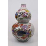 A Chinese double gourd porcelain vase, enamel decorated with warriors and trees, height 34cm